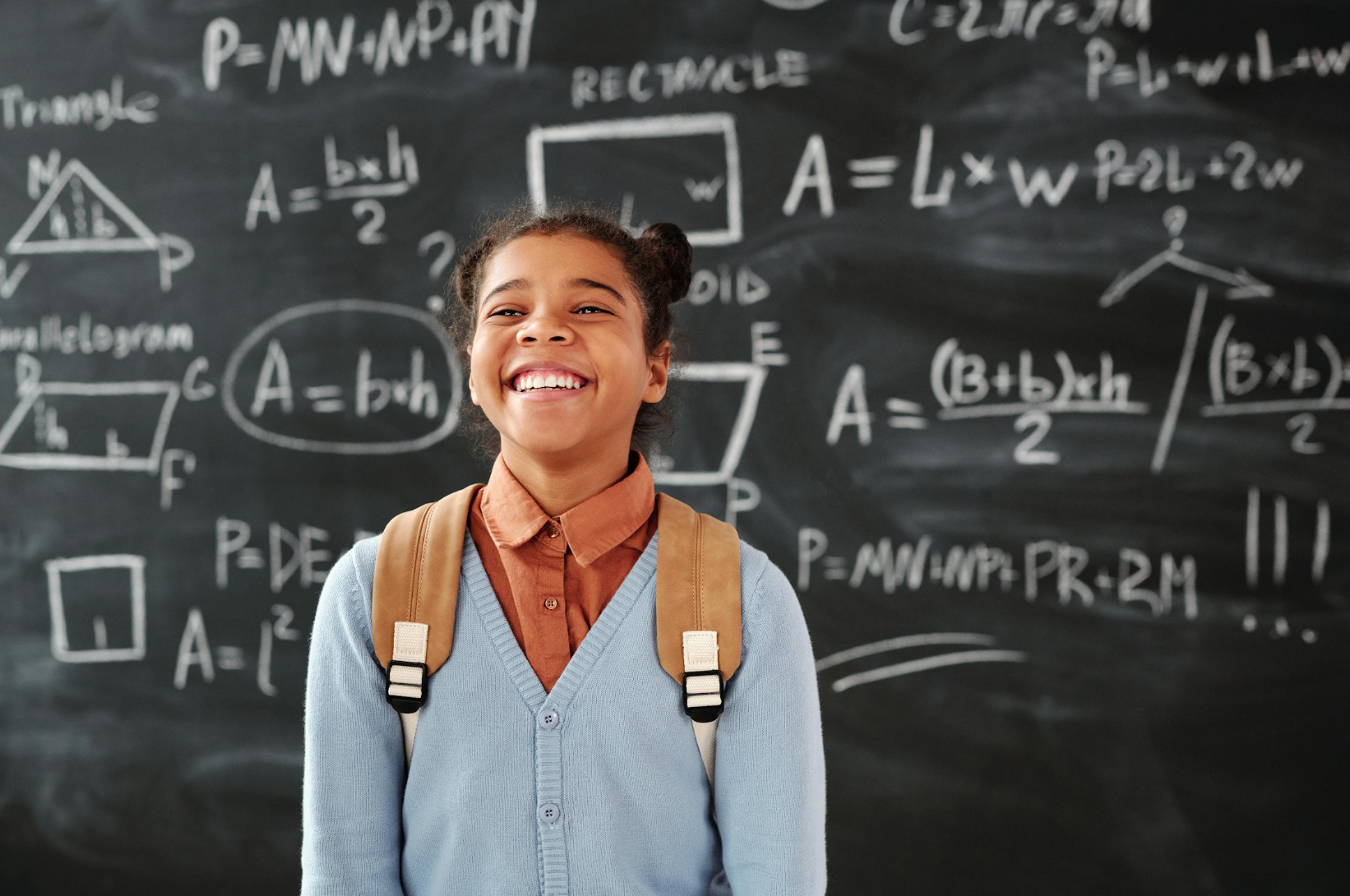 Smiling Girl Carrying a Backpack